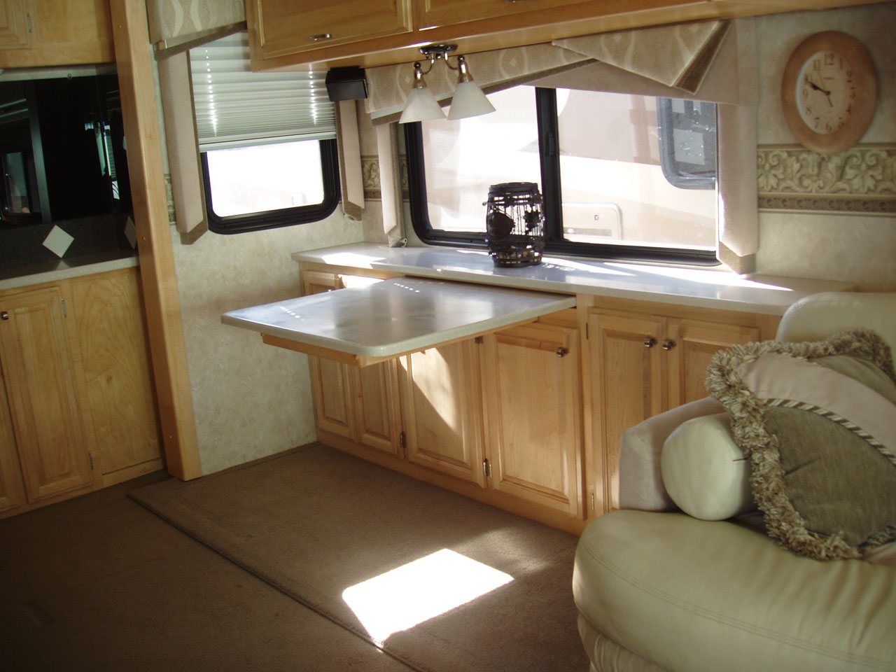 Retractable dining table with custom cabinets