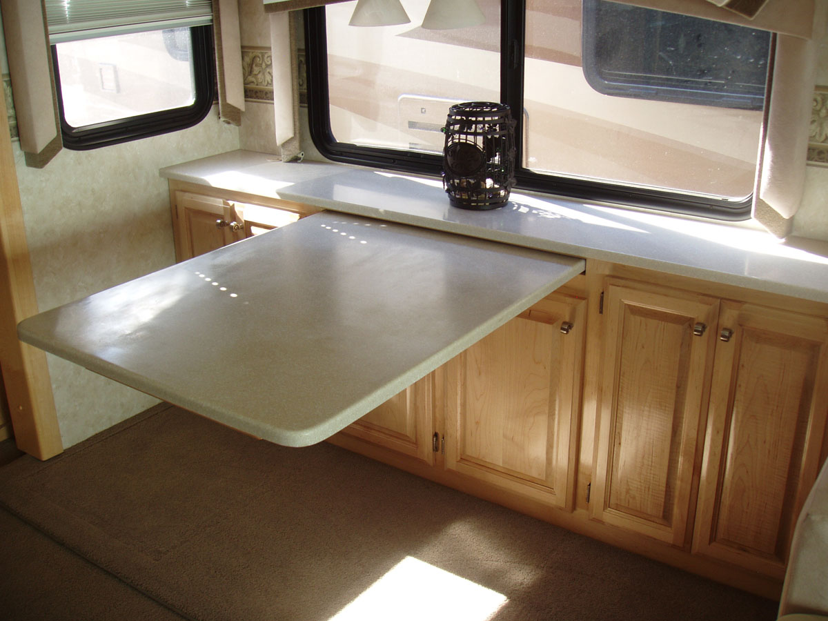 Retractable dining table with custom cabinets - close up